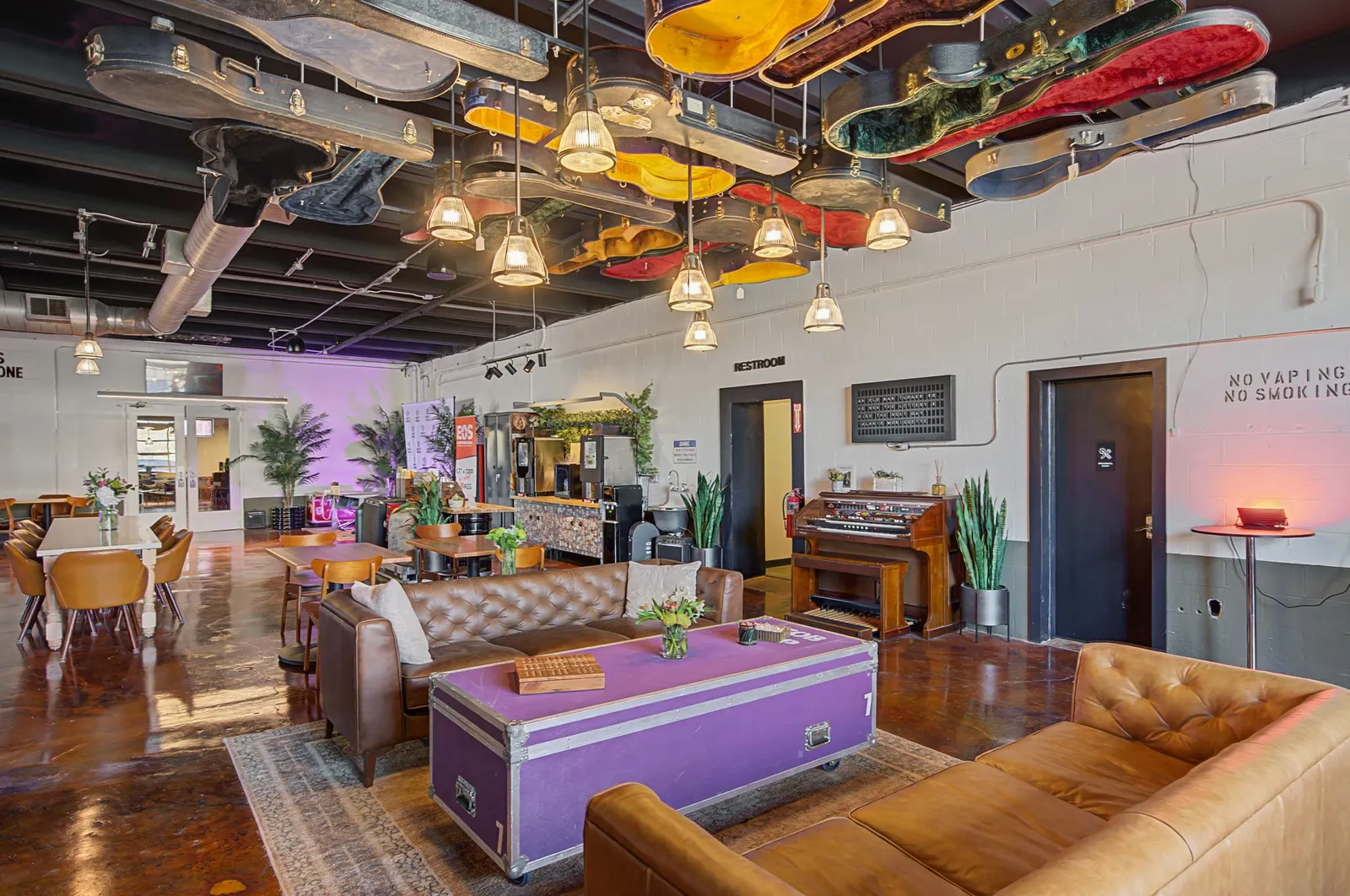 Open event floor with couches and tables at Music City Work Club in The Nations