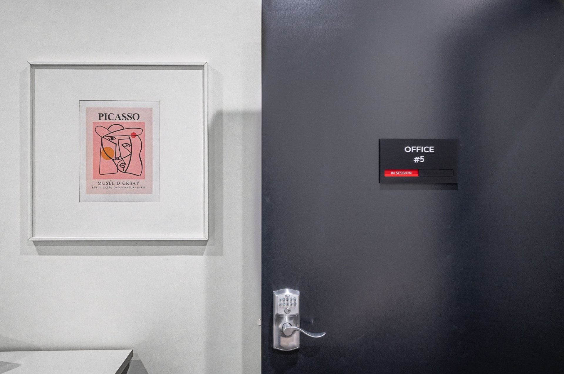 Private office entry with keypad lock and in-session indicator