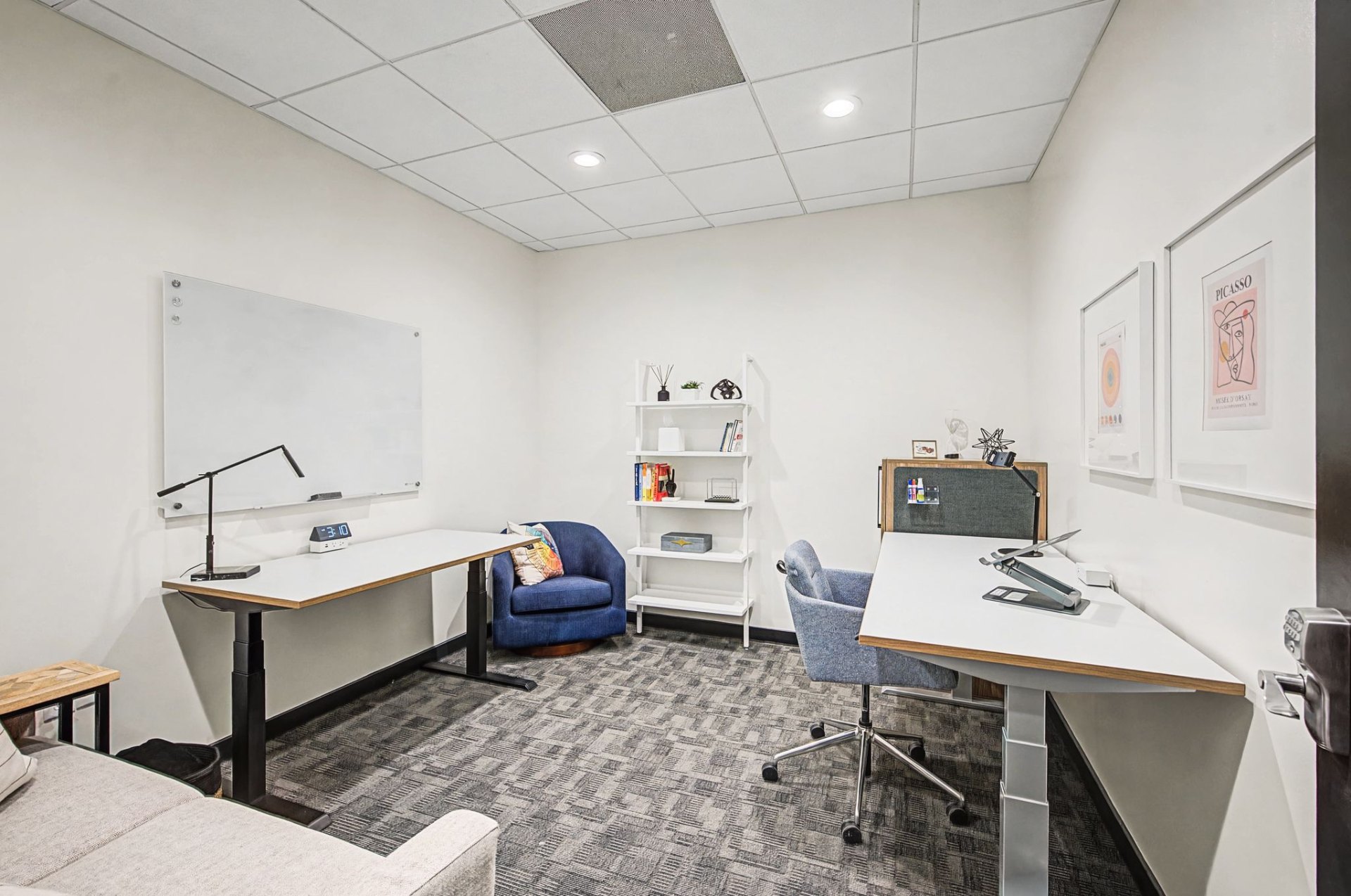 Private office with dual desks and reading chair