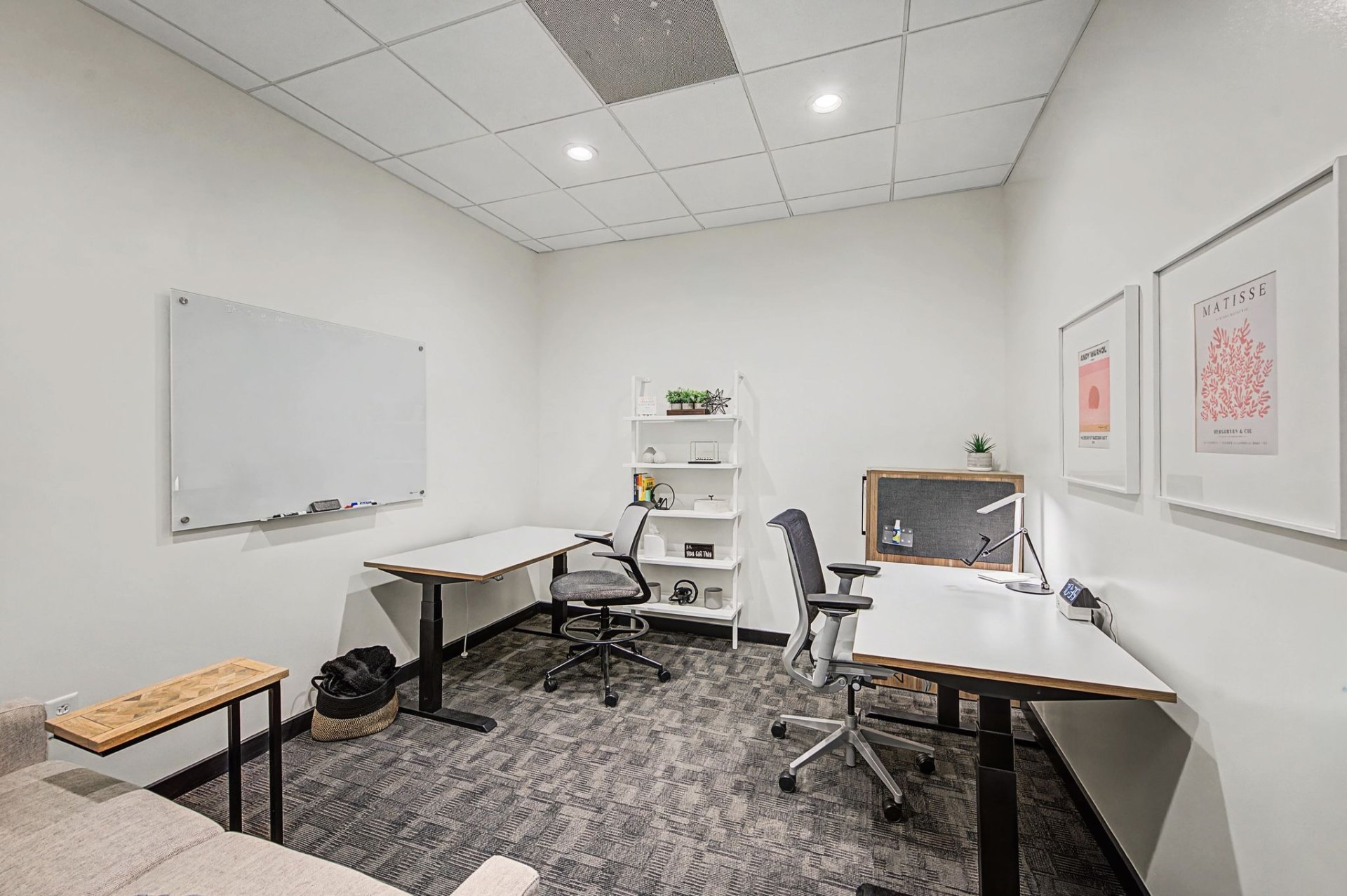 Private office with dual standing desks and whiteboard